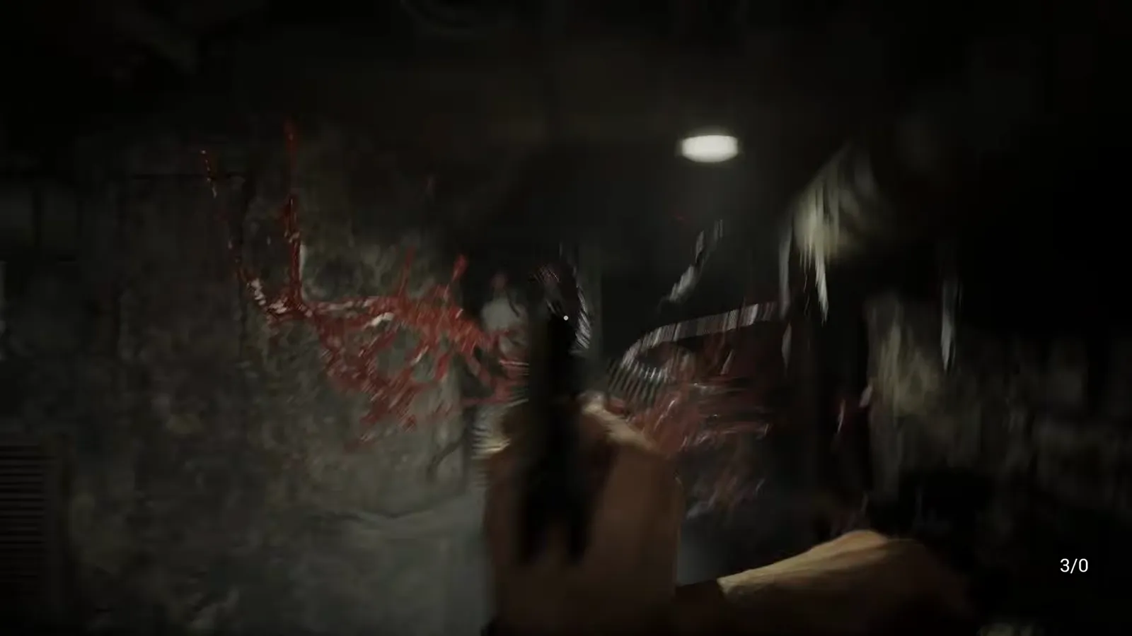 Red tendril growth on a wall beside a pale humanoid figure standing in low light