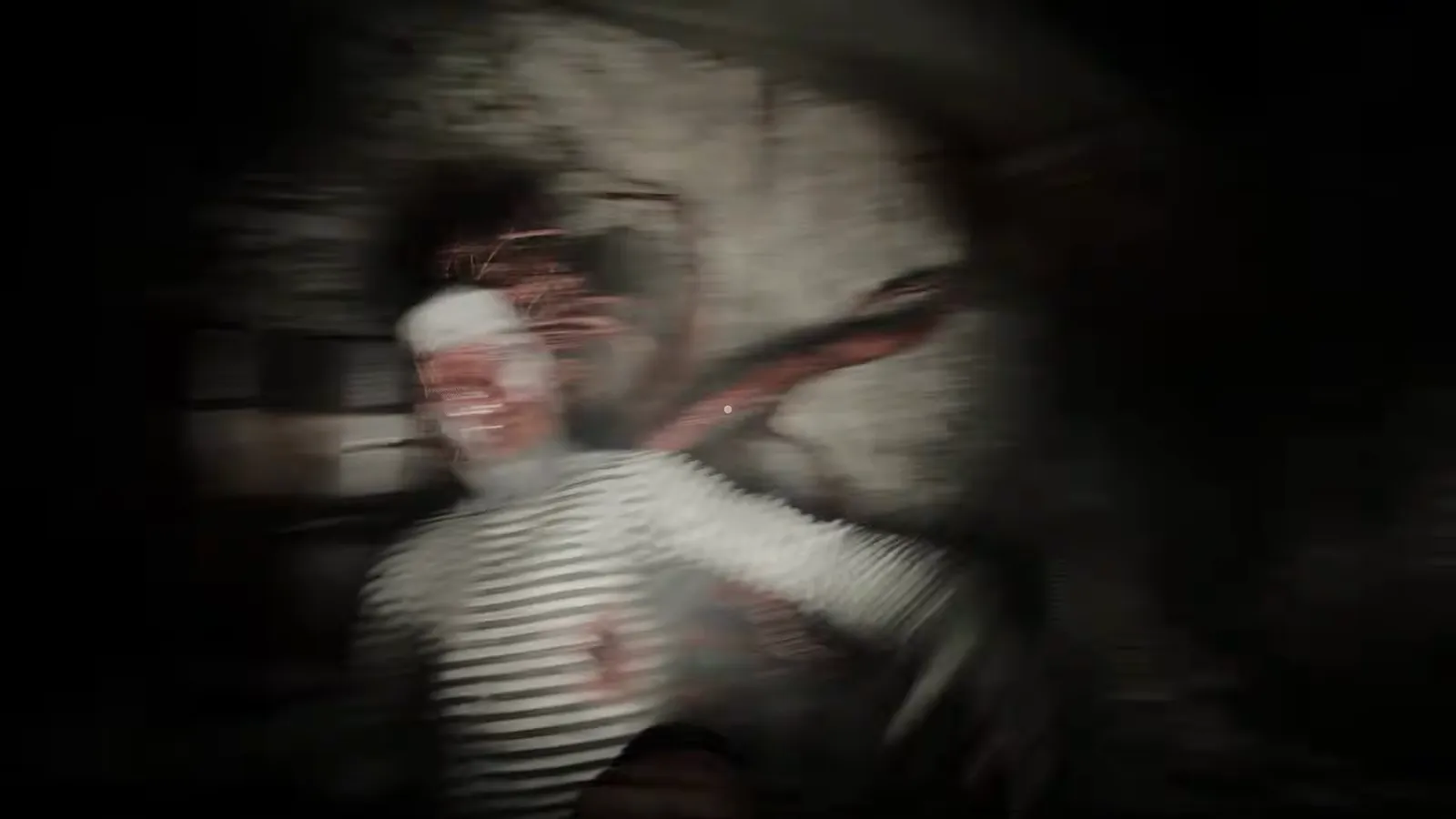 Striped-shirt humanoid figure lunging forward toward the first-person camera in a tight corridor